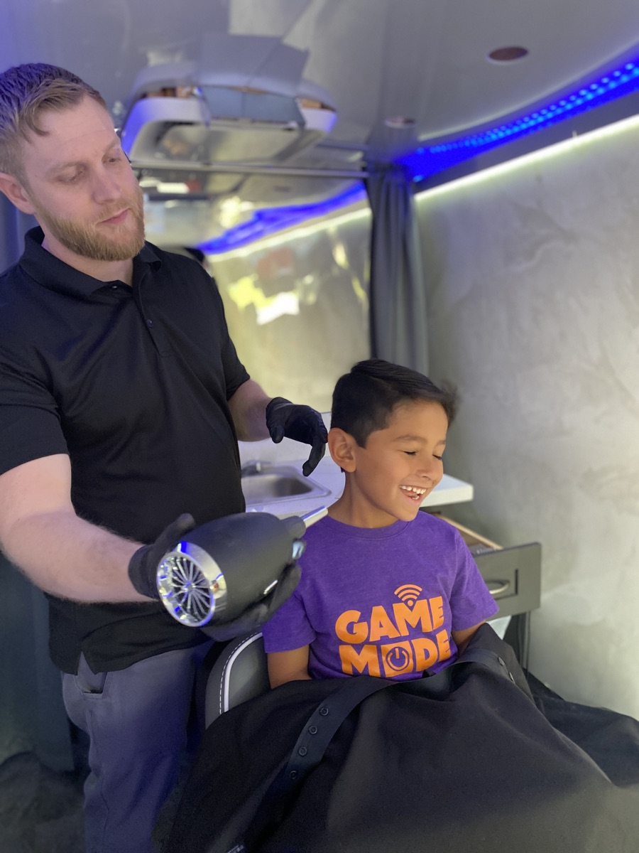 A happy client enjoying the blowdry experience