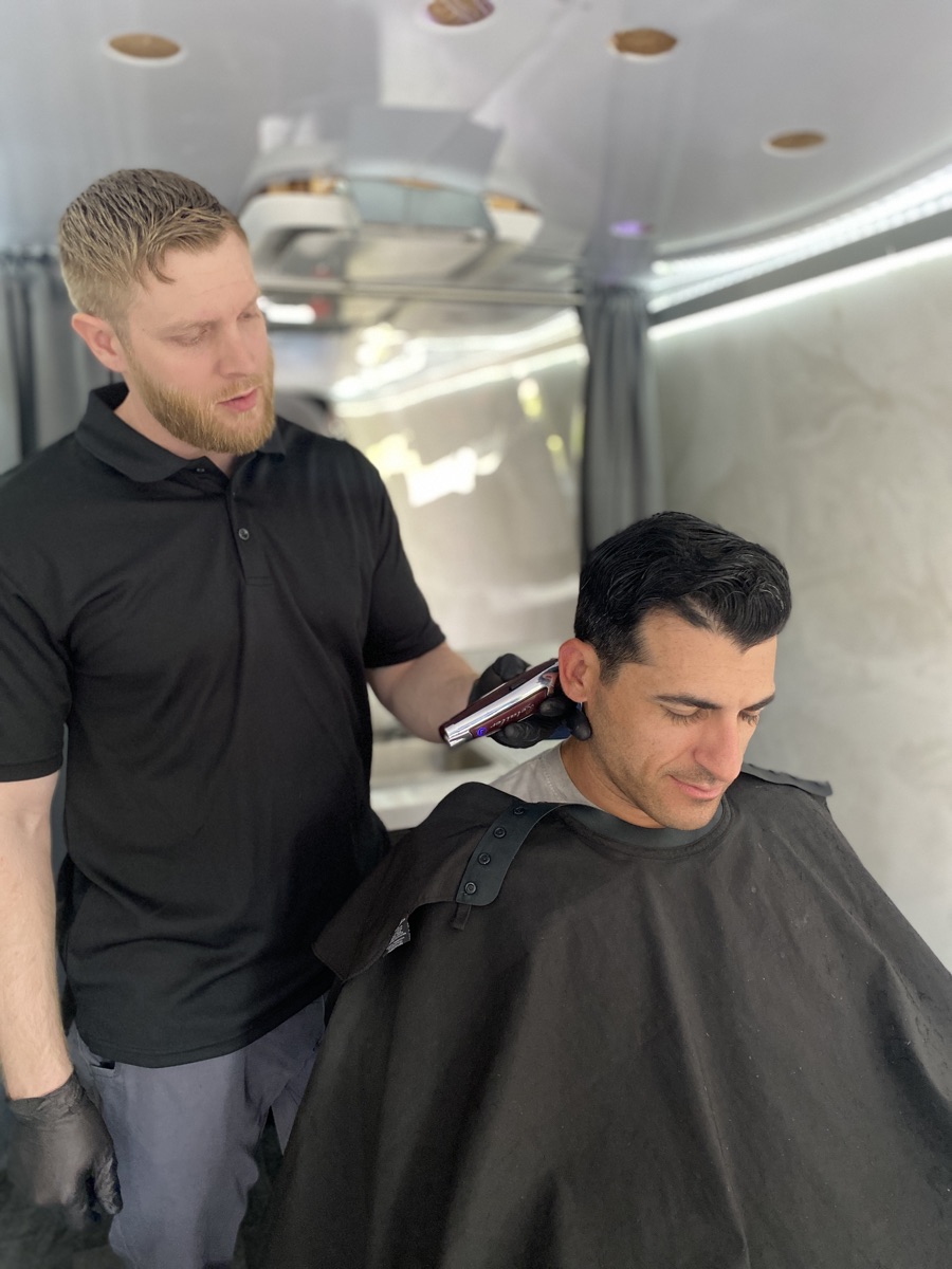 Precision clipper work during a mobile haircut session